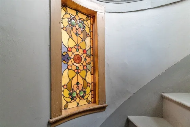 a bathroom with a toilet and shower curtain