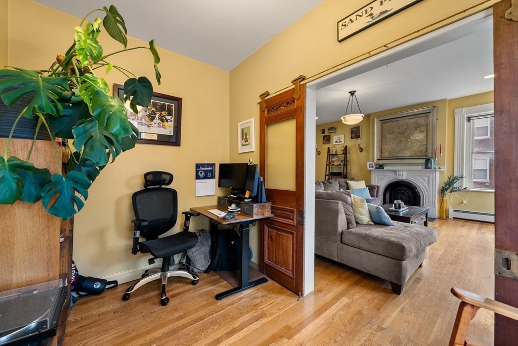 468 Shawmut Avenue, Unit 2 Boston, MA 02118 - Photo 4 of 30 a view of a livingroom with workspace and a couch