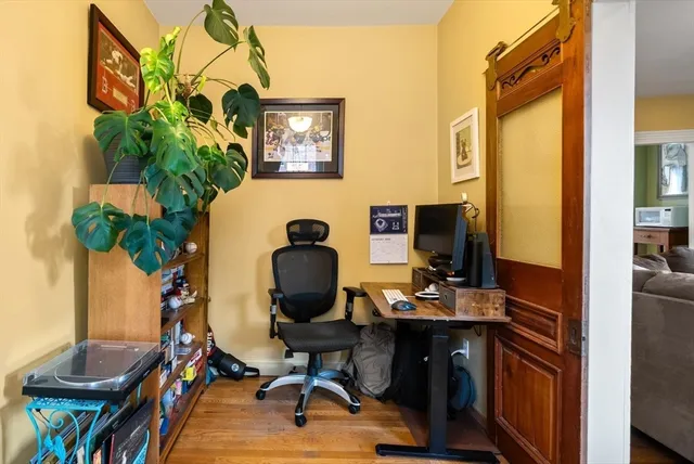 a workspace with furniture and wooden floor