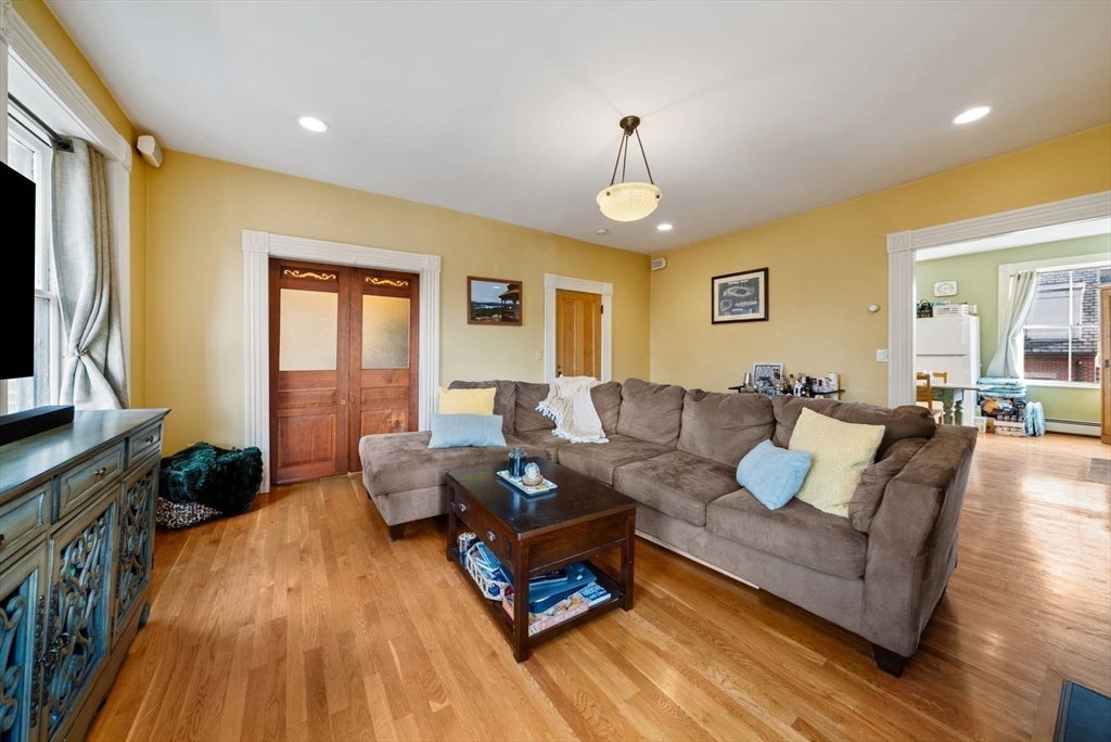 468 Shawmut Avenue, Unit 2 Boston, MA 02118 - Photo 6 of 30 a living room with furniture and a flat screen tv