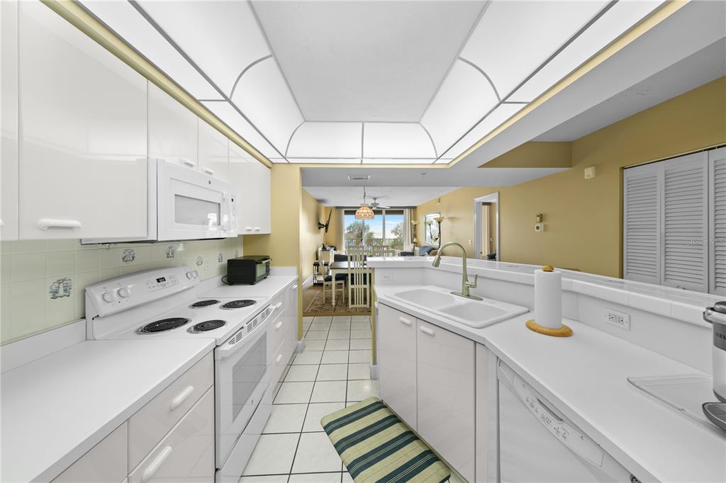 4575 South Atlantic Avenue, Unit 6209 Ponce Inlet, FL 32127 - Photo 19 of 53 a kitchen with a sink appliances and cabinets