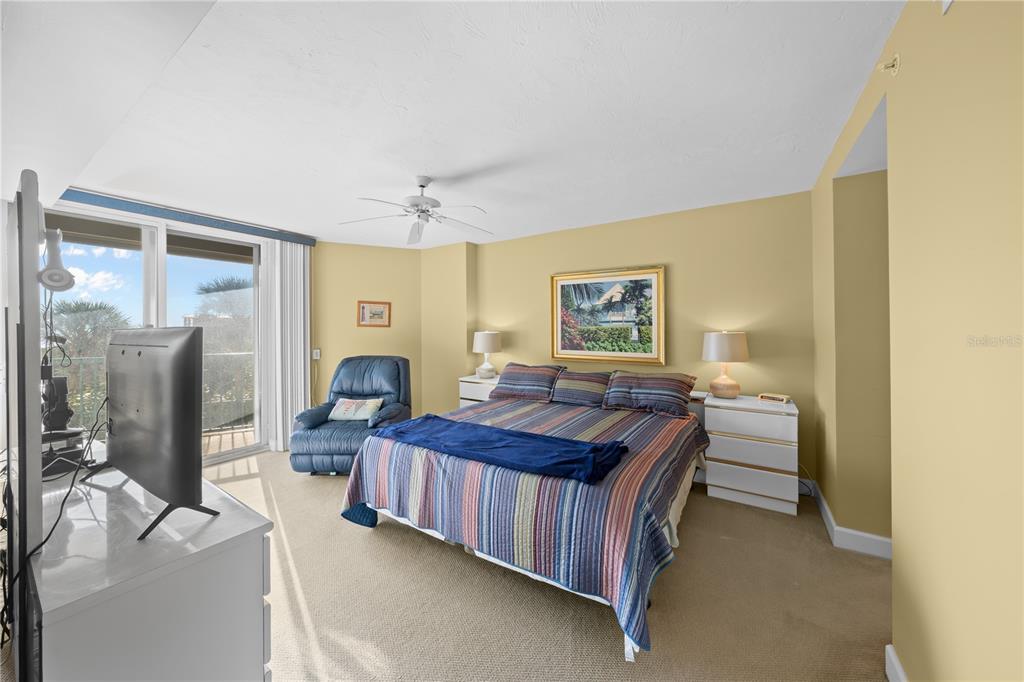 4575 South Atlantic Avenue, Unit 6209 Ponce Inlet, FL 32127 - Photo 22 of 53 a bedroom with a bed couch and window