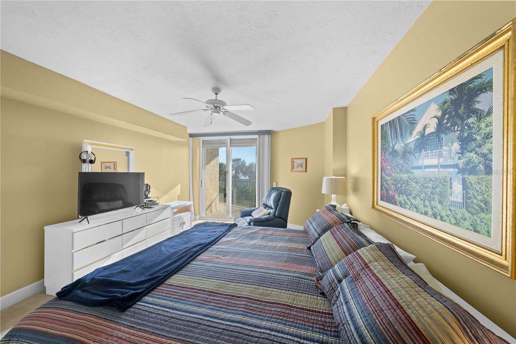4575 South Atlantic Avenue, Unit 6209 Ponce Inlet, FL 32127 - Photo 23 of 53 a bedroom with a bed and a flat screen tv