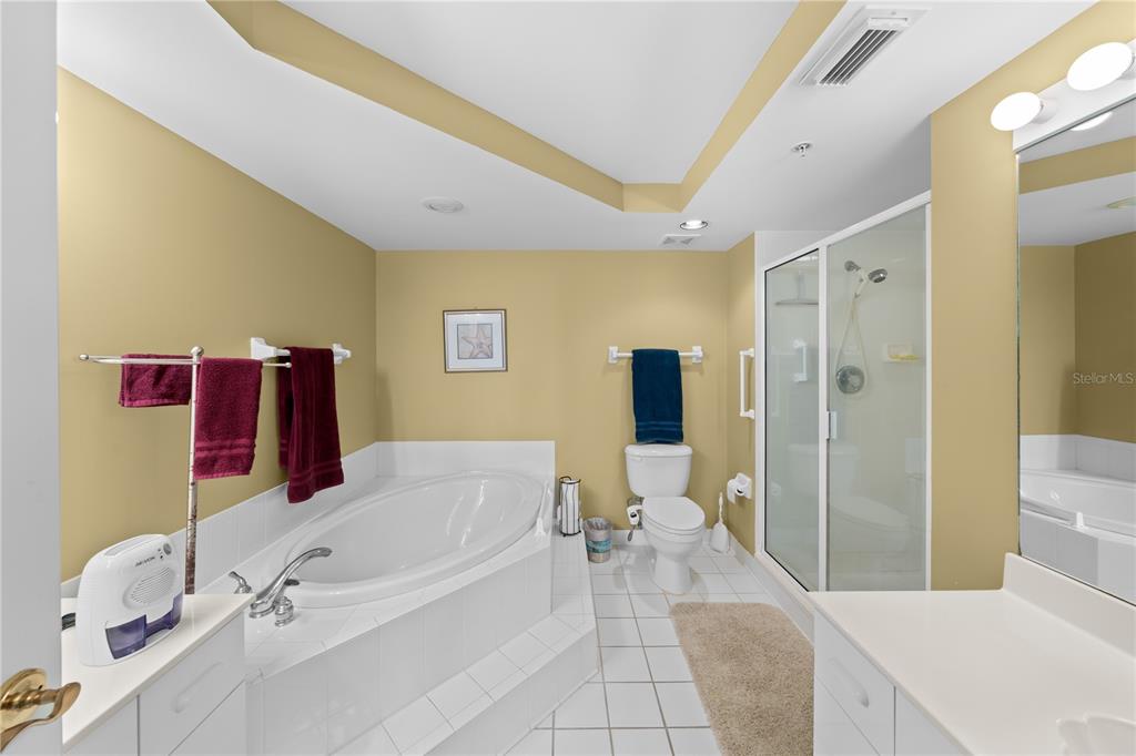 4575 South Atlantic Avenue, Unit 6209 Ponce Inlet, FL 32127 - Photo 28 of 53 a spacious bathroom with a tub sink and mirror