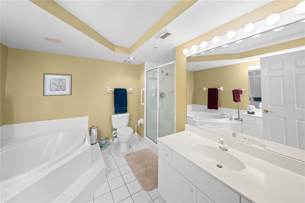 4575 South Atlantic Avenue, Unit 6209 Ponce Inlet, FL 32127 - Photo 29 of 53 a spacious bathroom with a double vanity sink mirror and bathtub