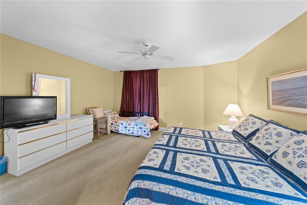 4575 South Atlantic Avenue, Unit 6209 Ponce Inlet, FL 32127 - Photo 32 of 53 a living room with furniture and a flat screen tv