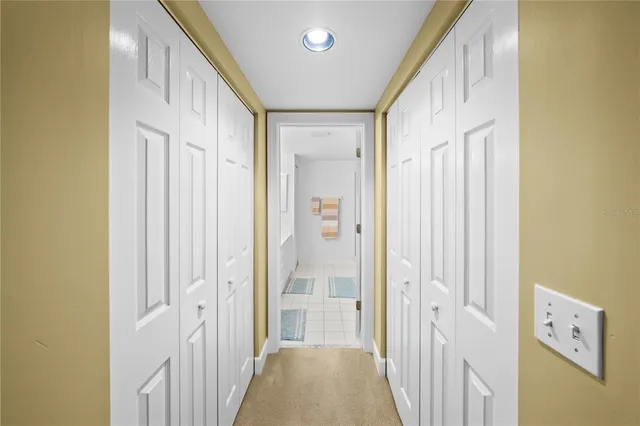 a spacious bathroom with a double vanity sink and mirror