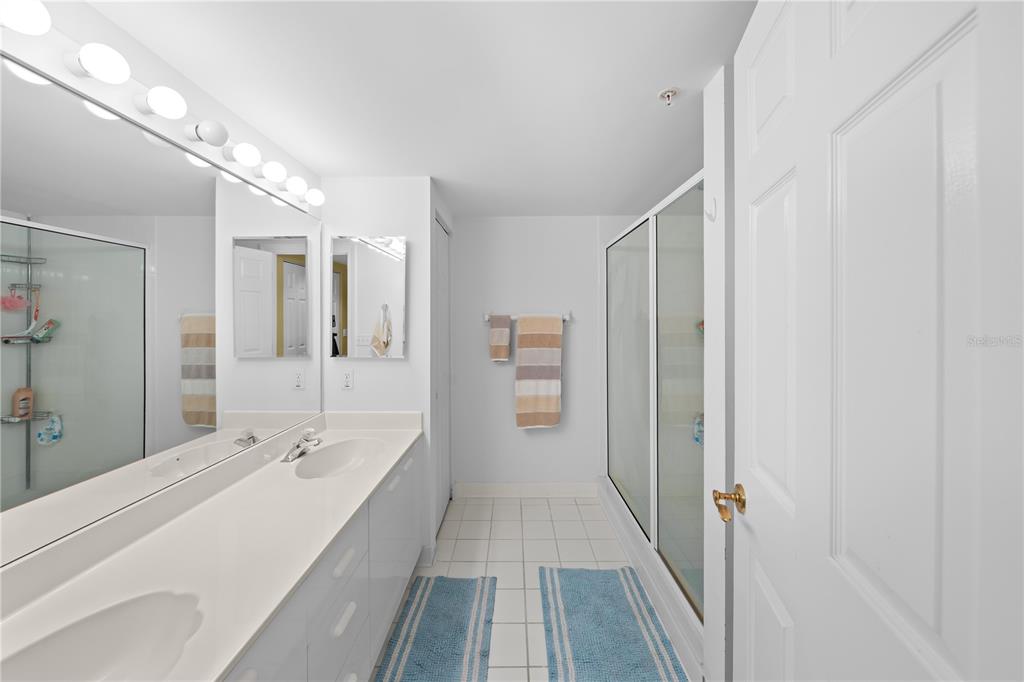 4575 South Atlantic Avenue, Unit 6209 Ponce Inlet, FL 32127 - Photo 36 of 53 a spacious bathroom with a double vanity sink and mirror
