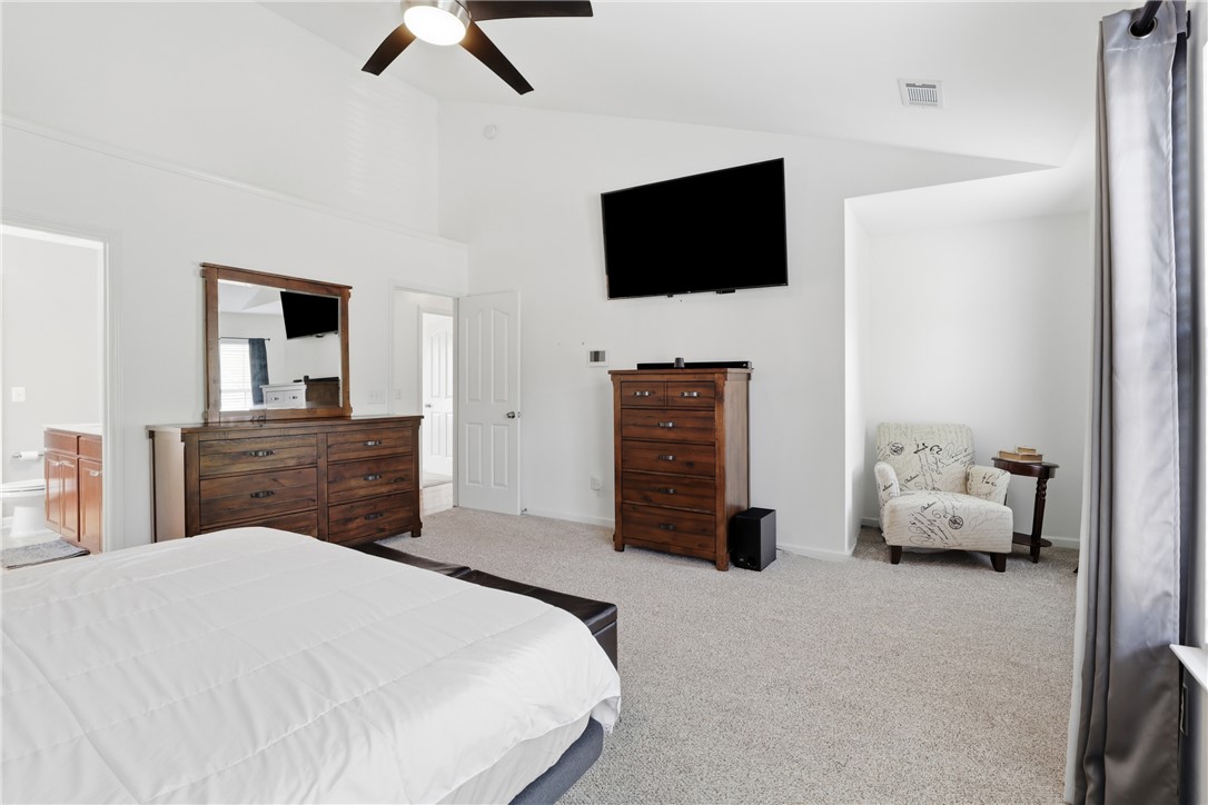 347 Riverdale Road Simpsonville, SC 29680 - Photo 11 of 30 This primary bedroom features high ceilings and soft carpeting, creating a tranquil retreat.
