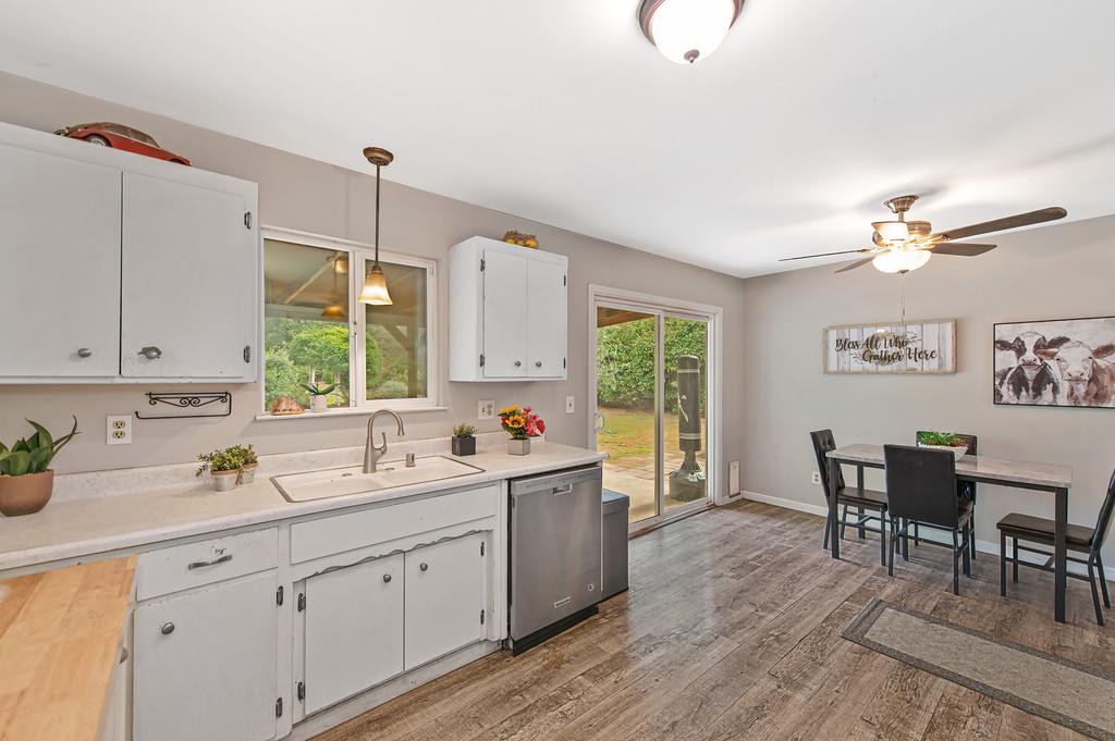 6689 Rhodes Avenue Placerville, CA 95667 - Photo 23 of 60 a kitchen with a sink stove and cabinets