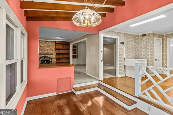 a kitchen with granite countertop a sink stove and cabinets