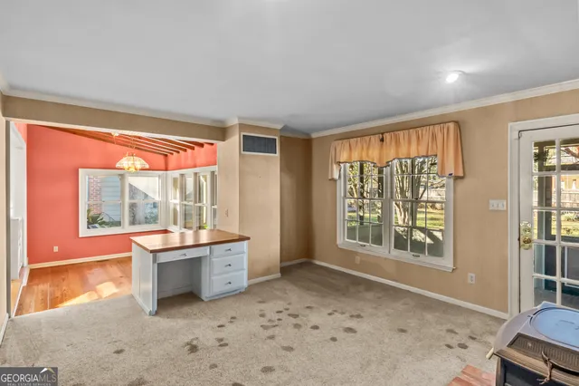 a view of an entryway with wooden floor