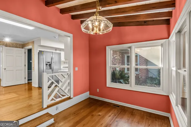a kitchen with granite countertop a sink stove and cabinets