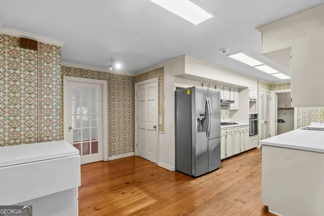 a kitchen with a sink cabinets and window