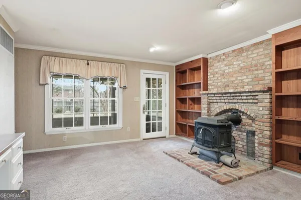 a view of a room with a ceiling fan