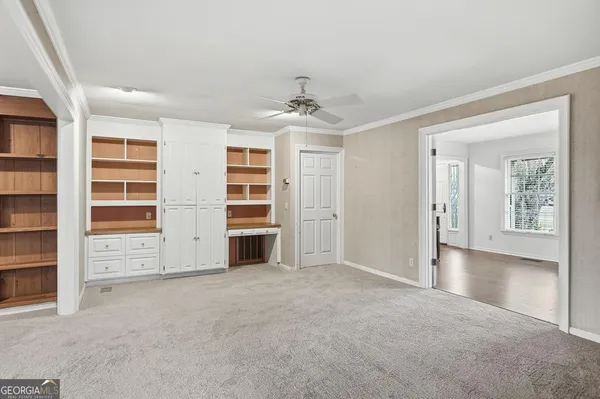 a view of an empty room with a window