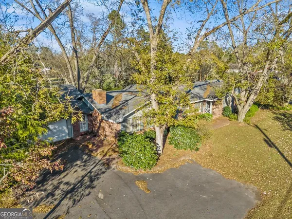 a aerial view of a house with a yard