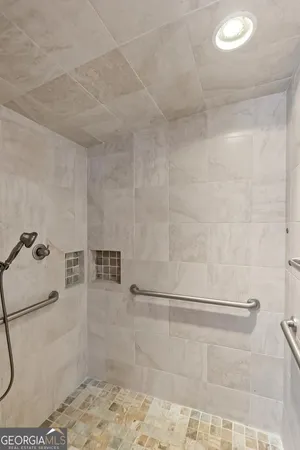 a view of a house with yard tree and wooden fence