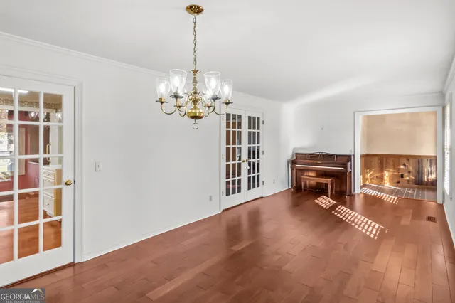a view of a room with furniture staircase and windows