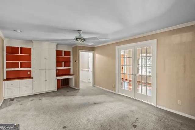 a view of an empty room with a window