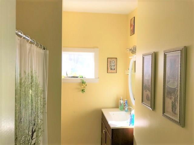 160 Middle Street Bath, ME 04530 - Photo 18 of 18 Cheery, bright bath with single vanity.