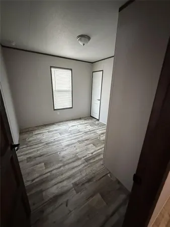 a view of room with window and hardwood floor