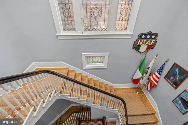 a living room with furniture a table and chairs