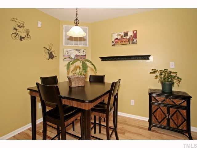 302 Graham Pond Road Angier, NC 27501 - Photo 4 of 12 a view of a dining room with furniture and wooden floor