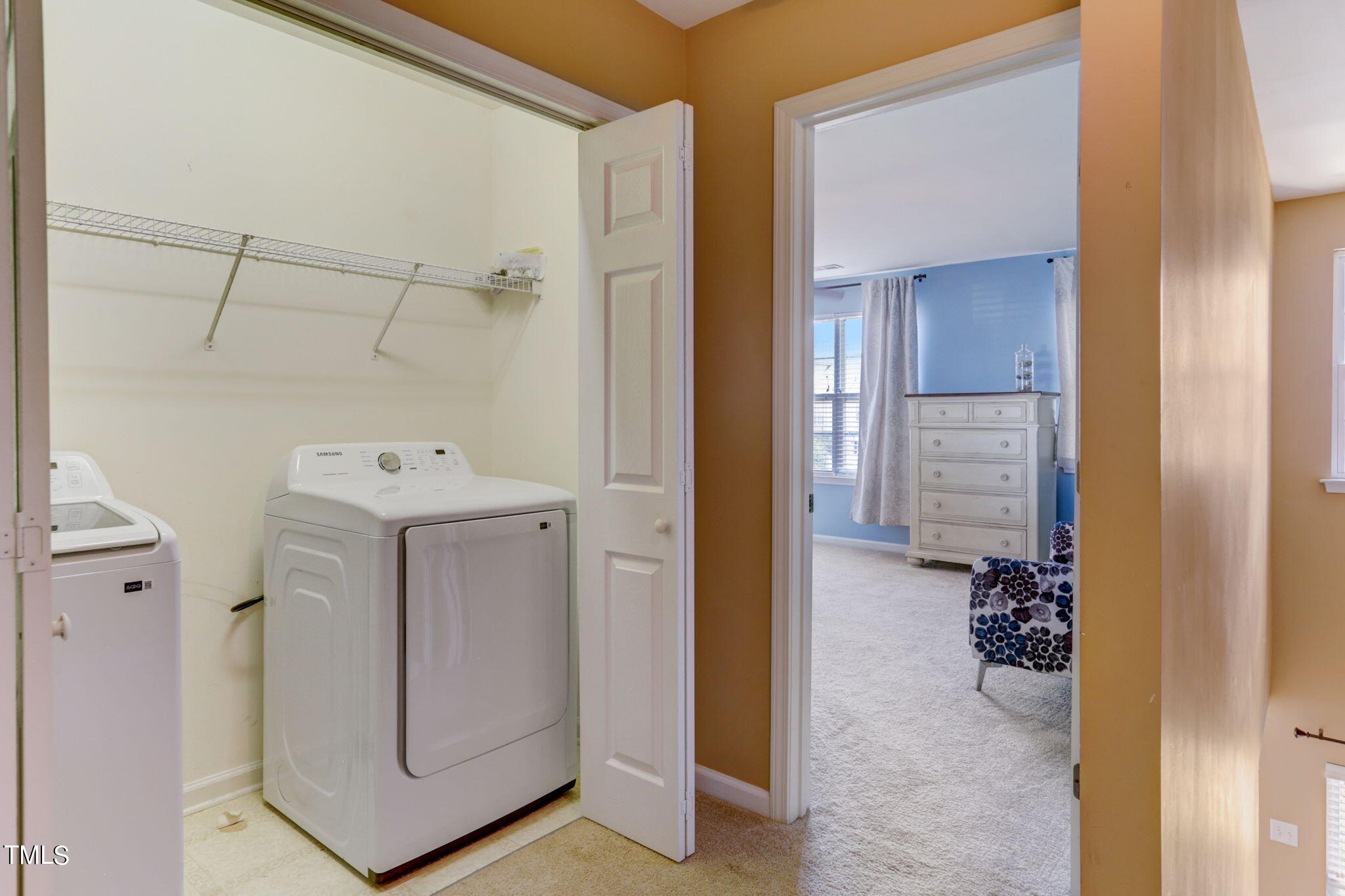 9802 Grettle Court Raleigh, NC 27617 - Photo 21 of 22 a utility room with cabinets