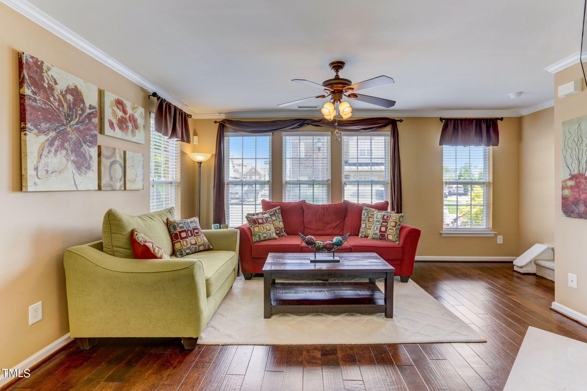 9802 Grettle Court Raleigh, NC 27617 - Photo 6 of 22 a living room with furniture and wooden floor
