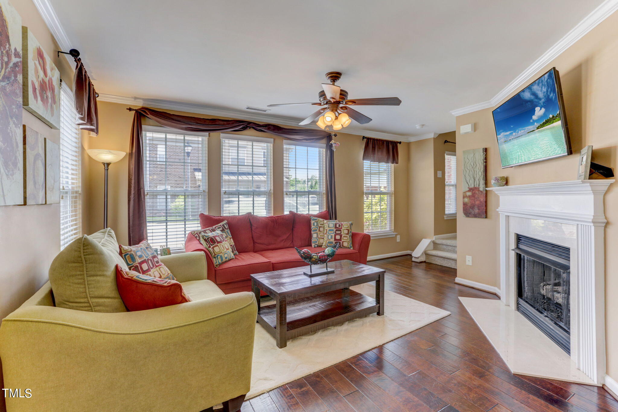 9802 Grettle Court Raleigh, NC 27617 - Photo 7 of 22 a living room with furniture fireplace and flat screen tv