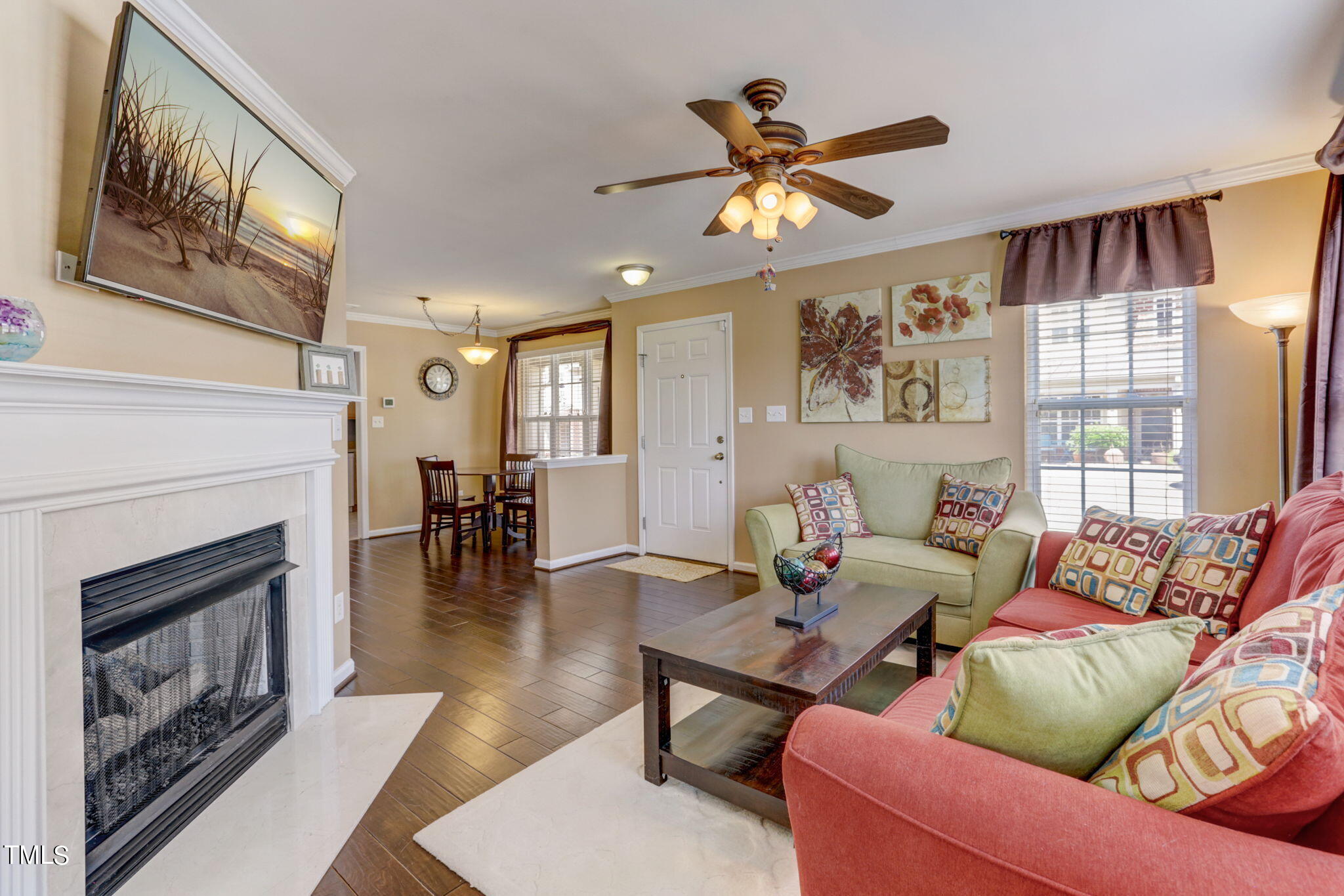 9802 Grettle Court Raleigh, NC 27617 - Photo 8 of 22 a living room with furniture and a fireplace