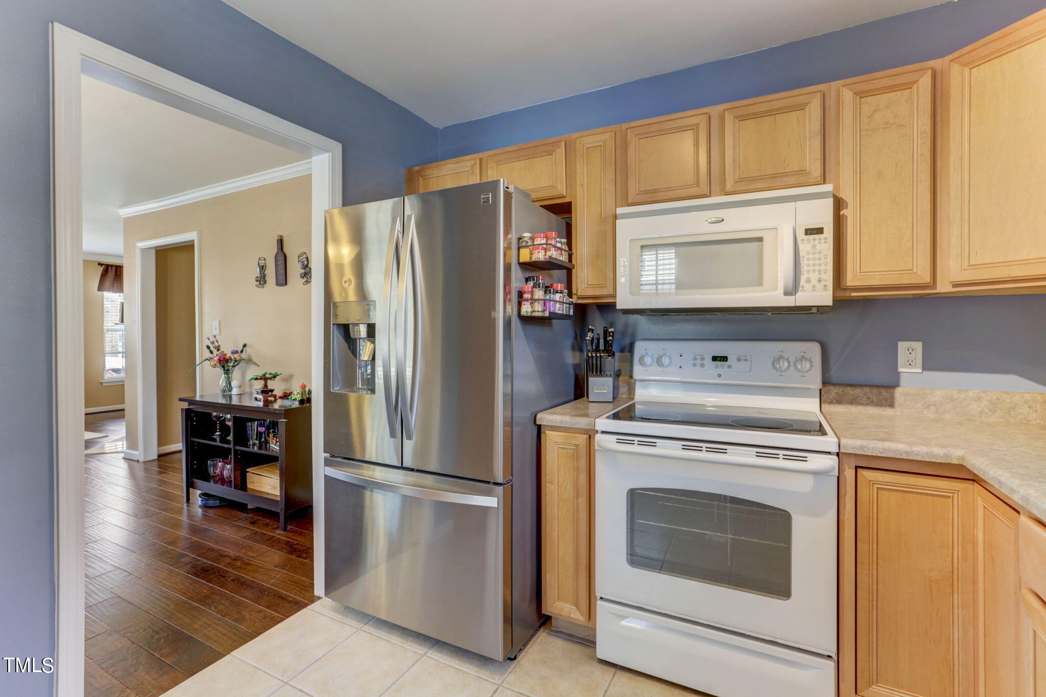 9802 Grettle Court Raleigh, NC 27617 - Photo 10 of 22 a kitchen with a stove top oven and refrigerator