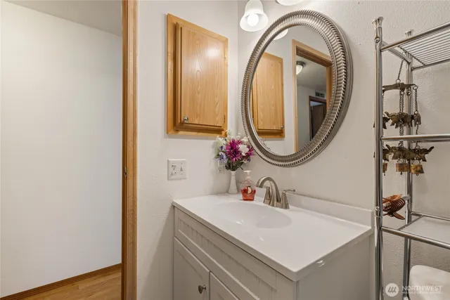 a bathroom with a sink and a mirror
