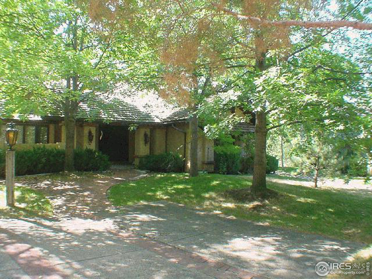 7130 Four Rivers Road Boulder, CO 80301 - Photo 2 of 10 a backyard of a house with lots of green space and fountain