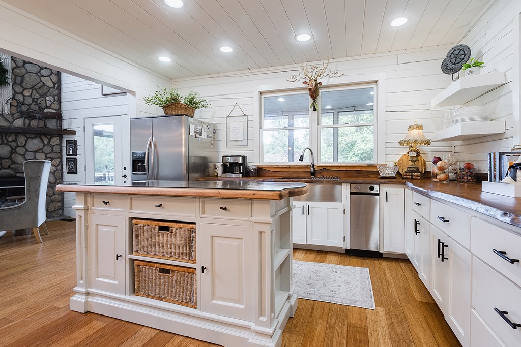 328 Black Ankle Creek Road Cherry Log, GA 30522 - Photo 15 of 103 a kitchen with stainless steel appliances granite countertop a sink cabinets and wooden floor