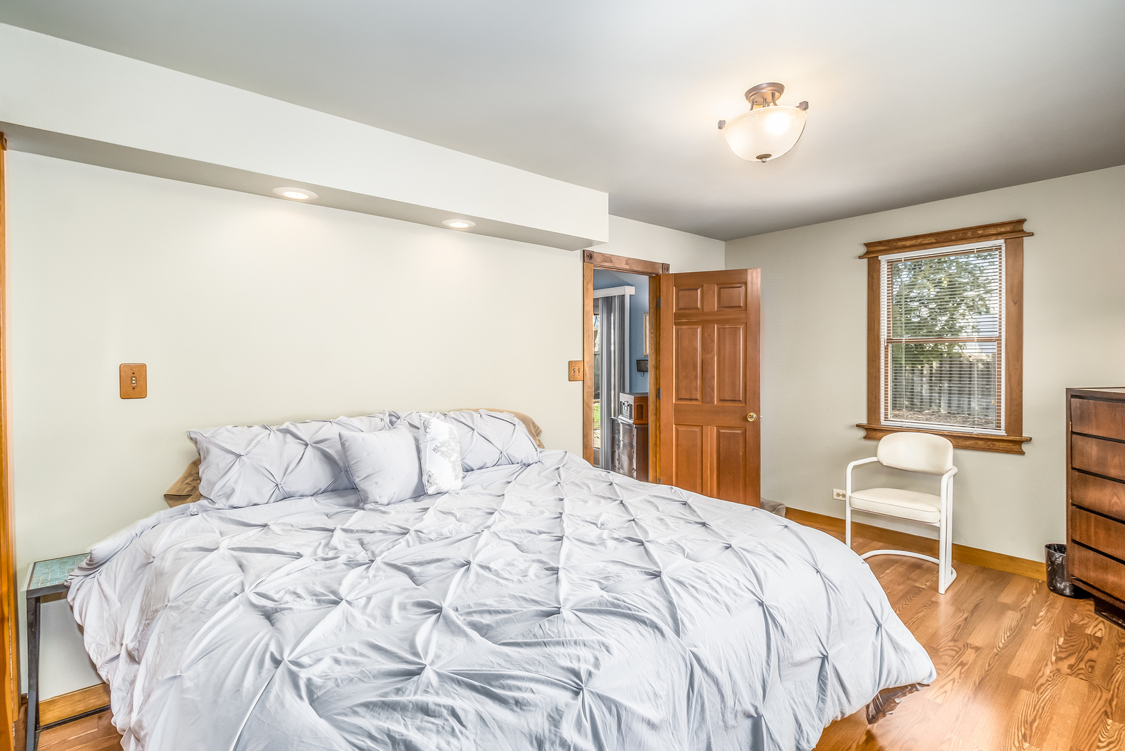 518 Amherst Avenue Romeoville, IL 60446 - Photo 17 of 23 a bedroom with a large bed and a chair