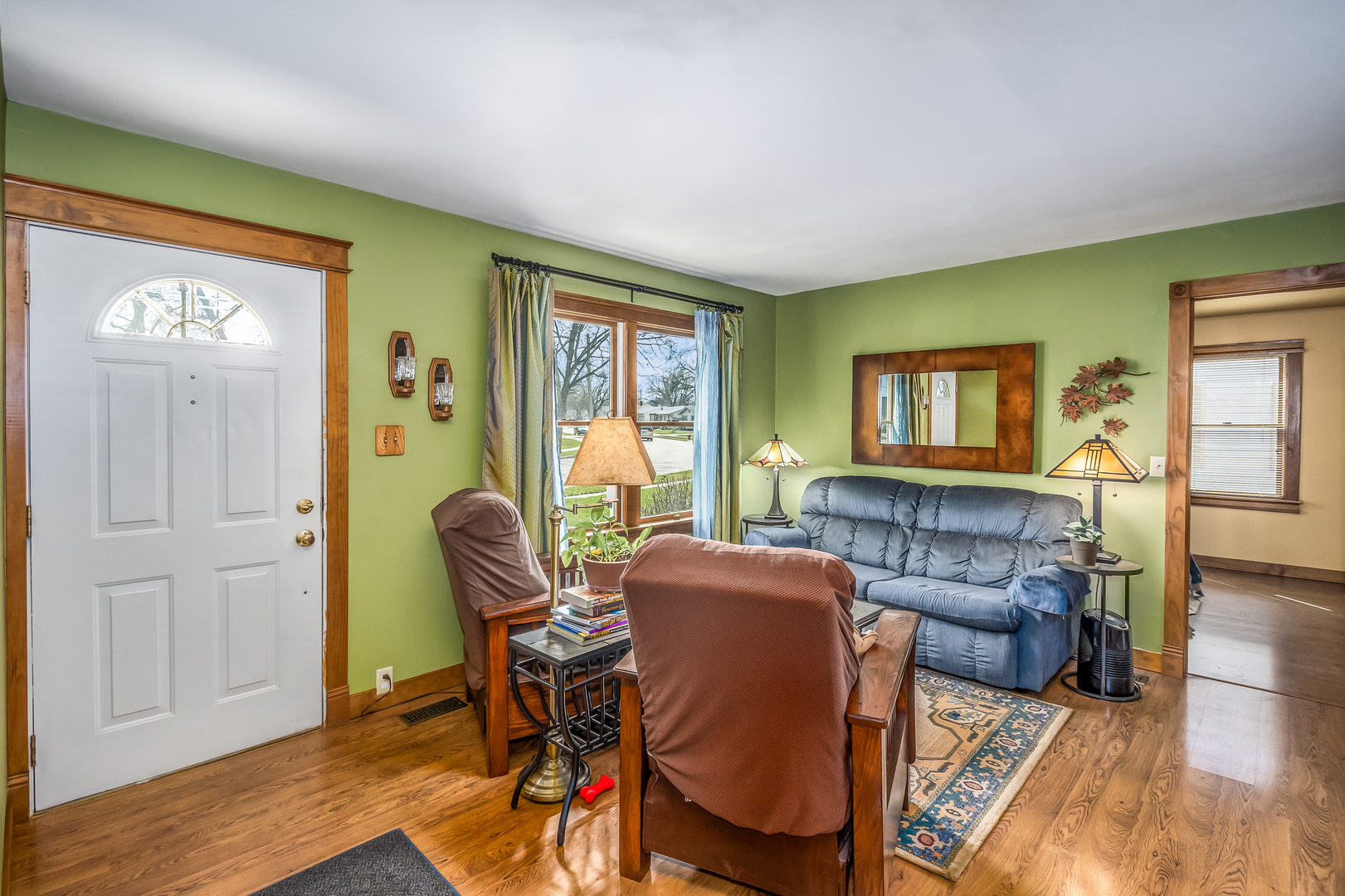 518 Amherst Avenue Romeoville, IL 60446 - Photo 2 of 23 a living room with furniture and a wooden floor