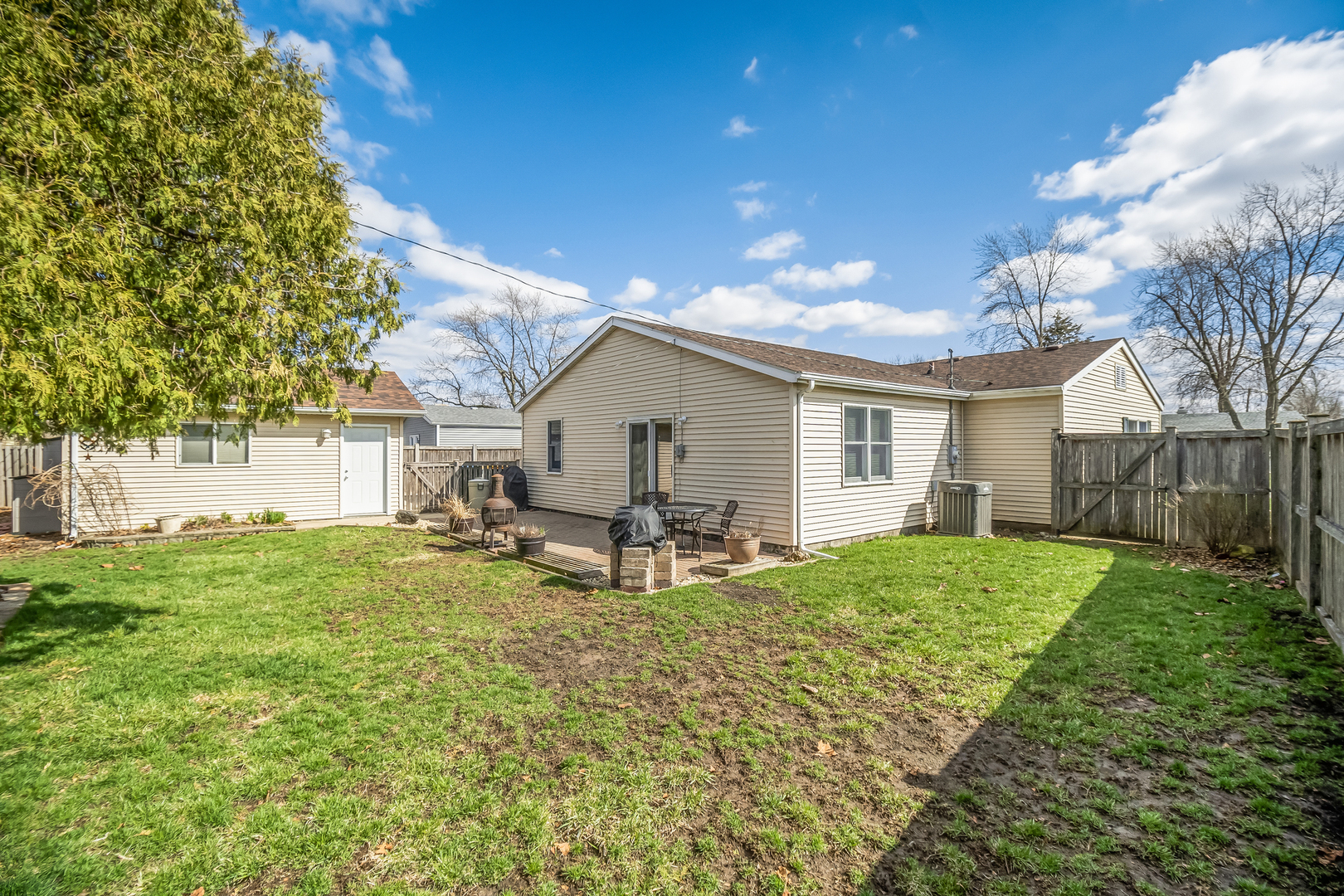 518 Amherst Avenue Romeoville, IL 60446 - Photo 22 of 23 a view of a house with backyard and sitting area