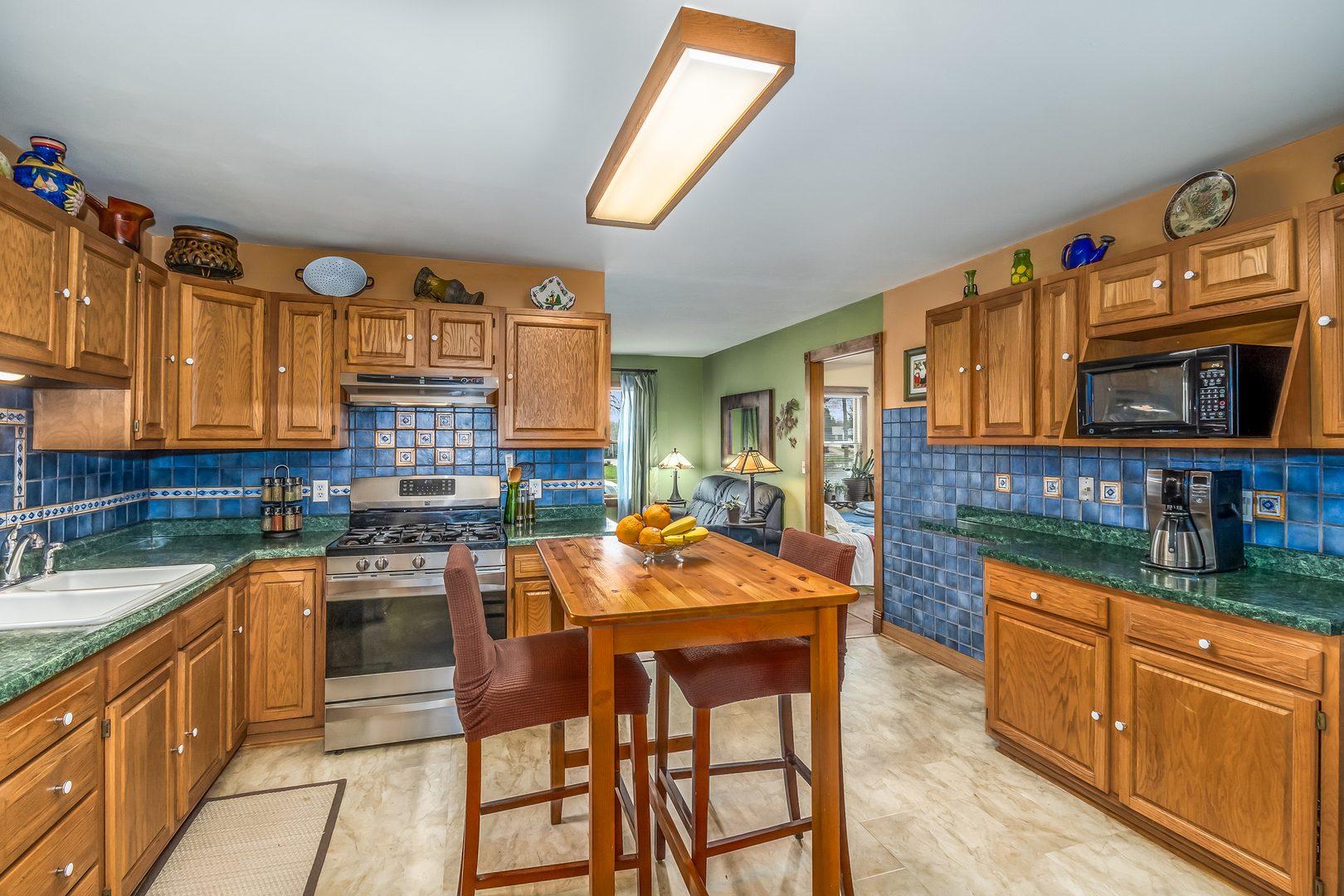 518 Amherst Avenue Romeoville, IL 60446 - Photo 6 of 23 a kitchen with stainless steel appliances granite countertop a stove top oven a sink dishwasher and cabinets with wooden floor
