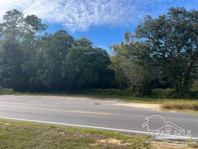a view of a swimming pool with a yard