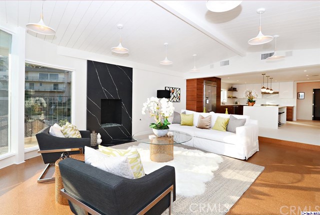 360 Kempton Road Glendale, CA 91202 - Photo 15 of 34 a living room with fireplace furniture and a large window
