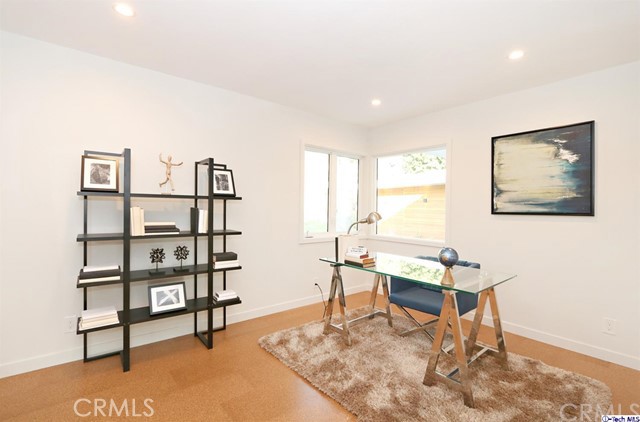 360 Kempton Road Glendale, CA 91202 - Photo 23 of 34 a living room with furniture a rug and a wall painting