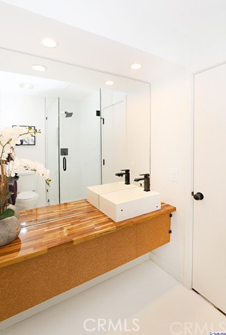 360 Kempton Road Glendale, CA 91202 - Photo 24 of 34 a bathroom with a bathtub and shower