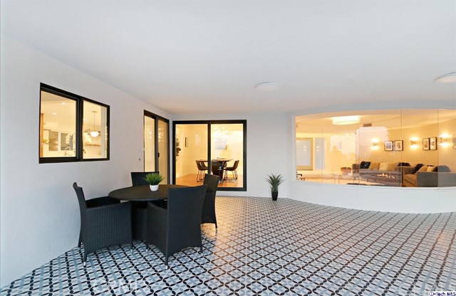 360 Kempton Road Glendale, CA 91202 - Photo 29 of 34 a dining room with furniture and a floor to ceiling window