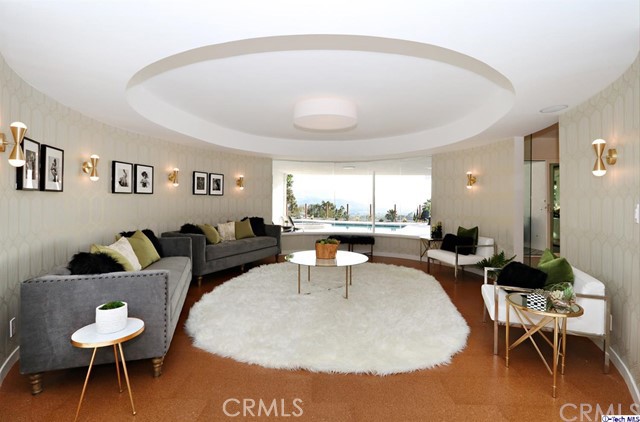 360 Kempton Road Glendale, CA 91202 - Photo 6 of 34 a living room with furniture a rug and a large window