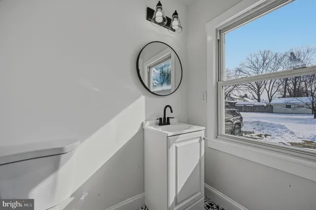 a bathroom with a toilet and a sink