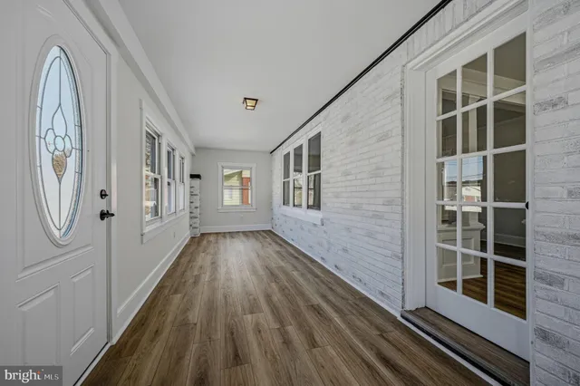 a view of a entryway with wooden floor