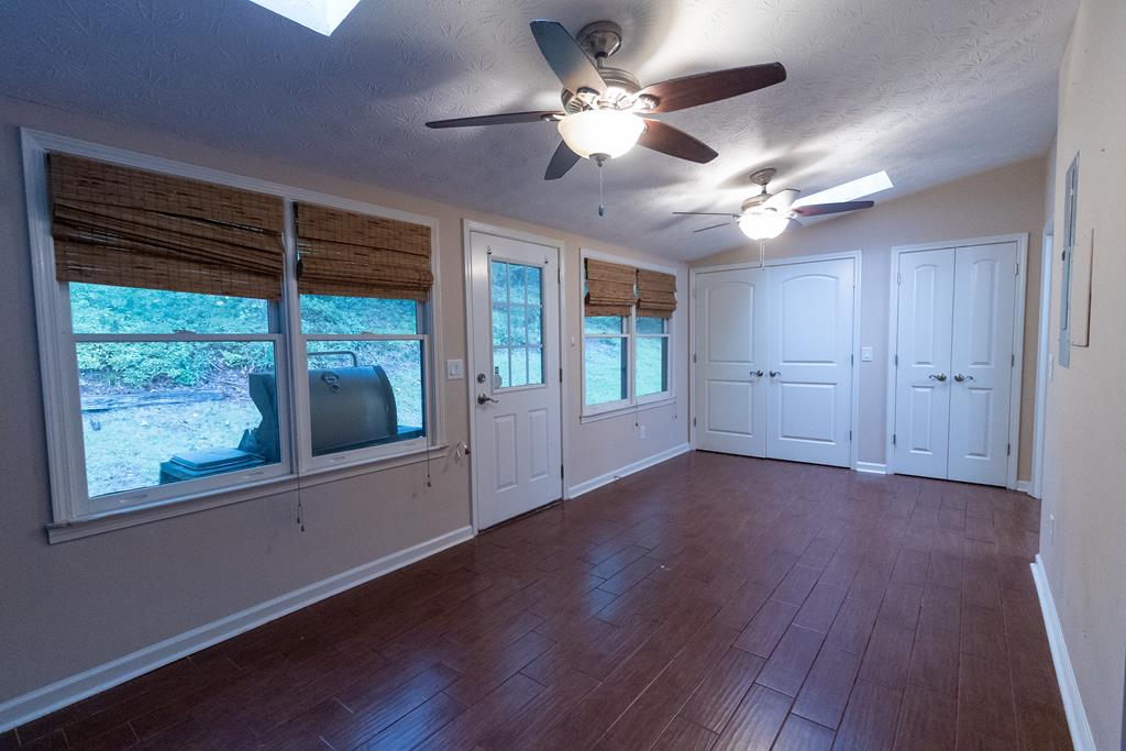 2525 Norris Road, Unit 36 Columbus, GA 31907 - Photo 12 of 28 a view of an empty room with a window and wooden floor