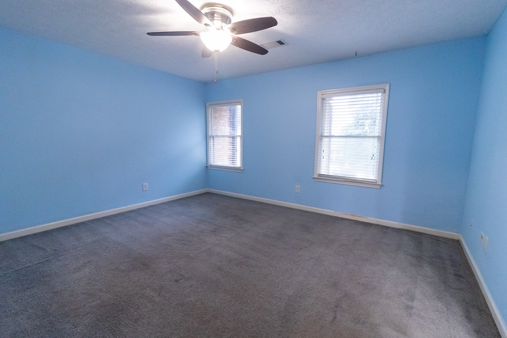 2525 Norris Road, Unit 36 Columbus, GA 31907 - Photo 15 of 28 an empty room with a window and a fan